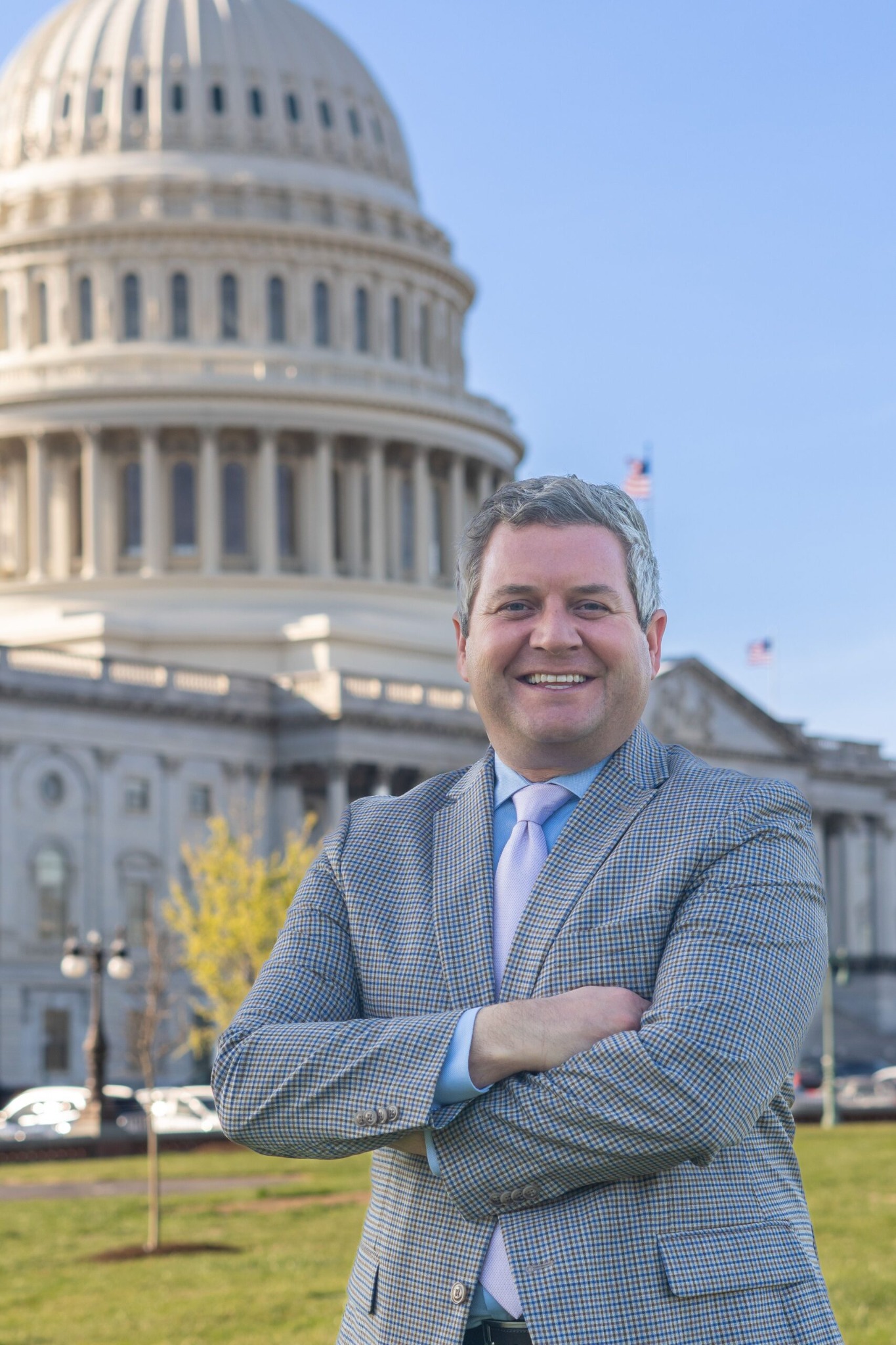 TC Wolfe standing in front of the United States Capitol